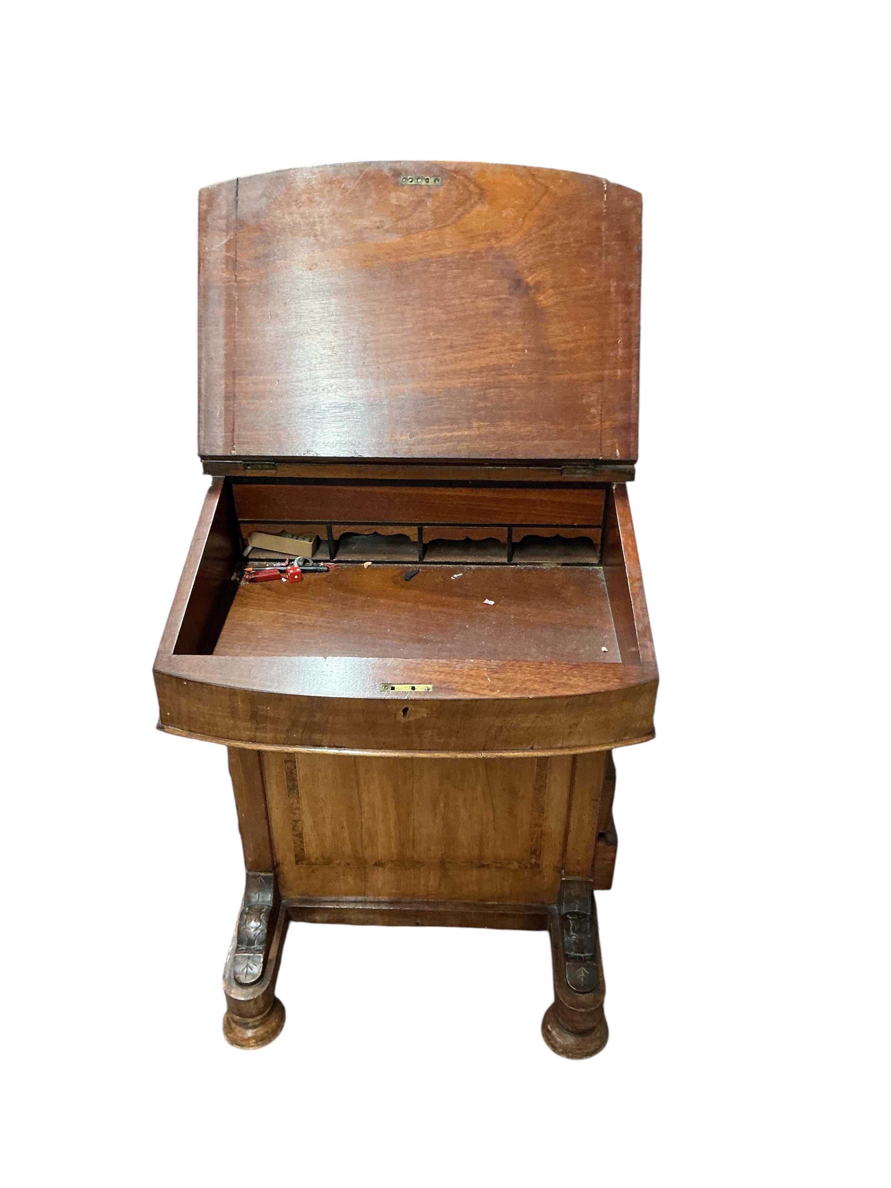 A late Victorian banded walnut Davenport, width 53cm, depth 54cm, height 84cm